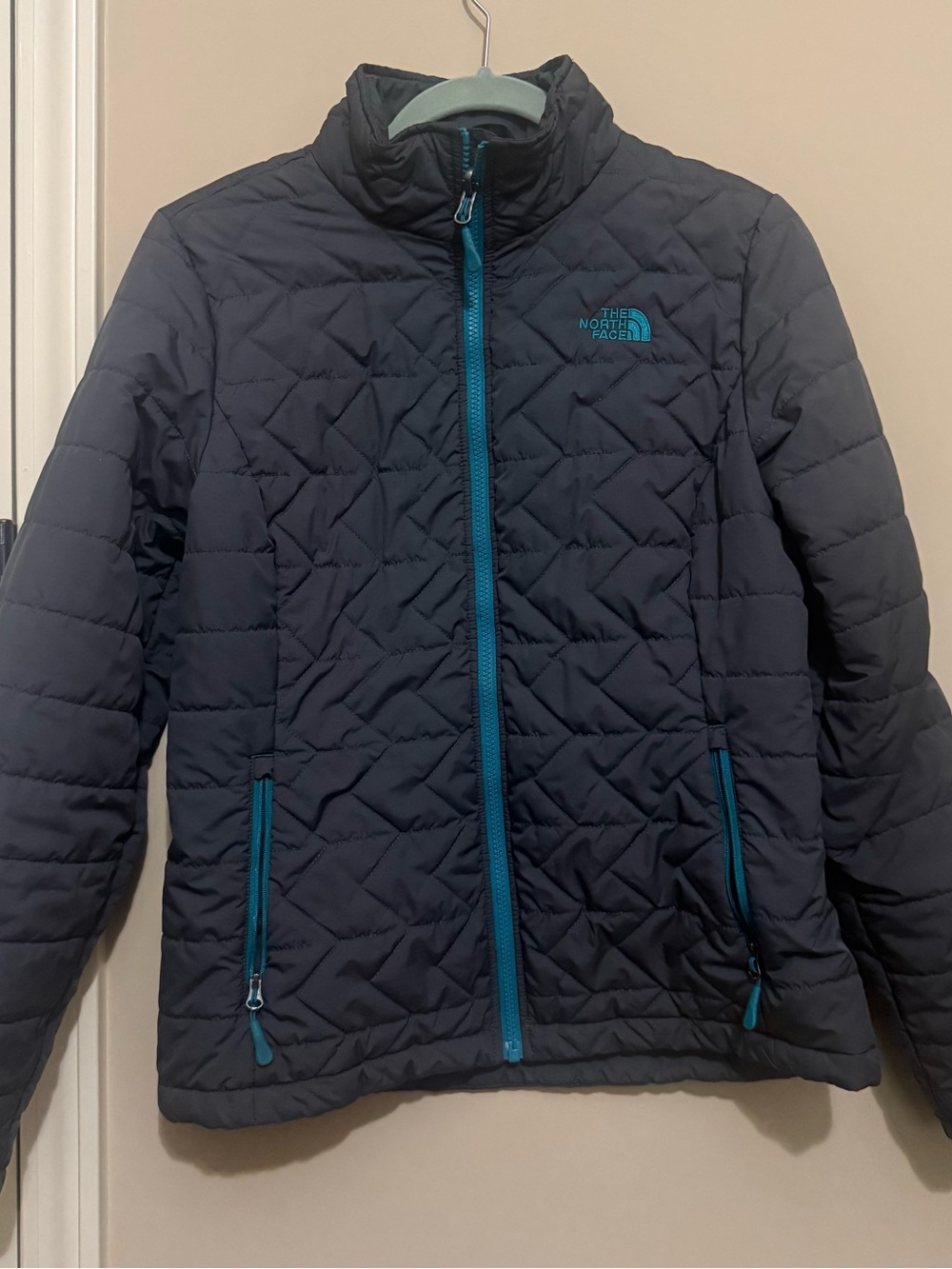 The North Face Tamburello Quilted Jacket in Charcoal Gray with Teal Accents